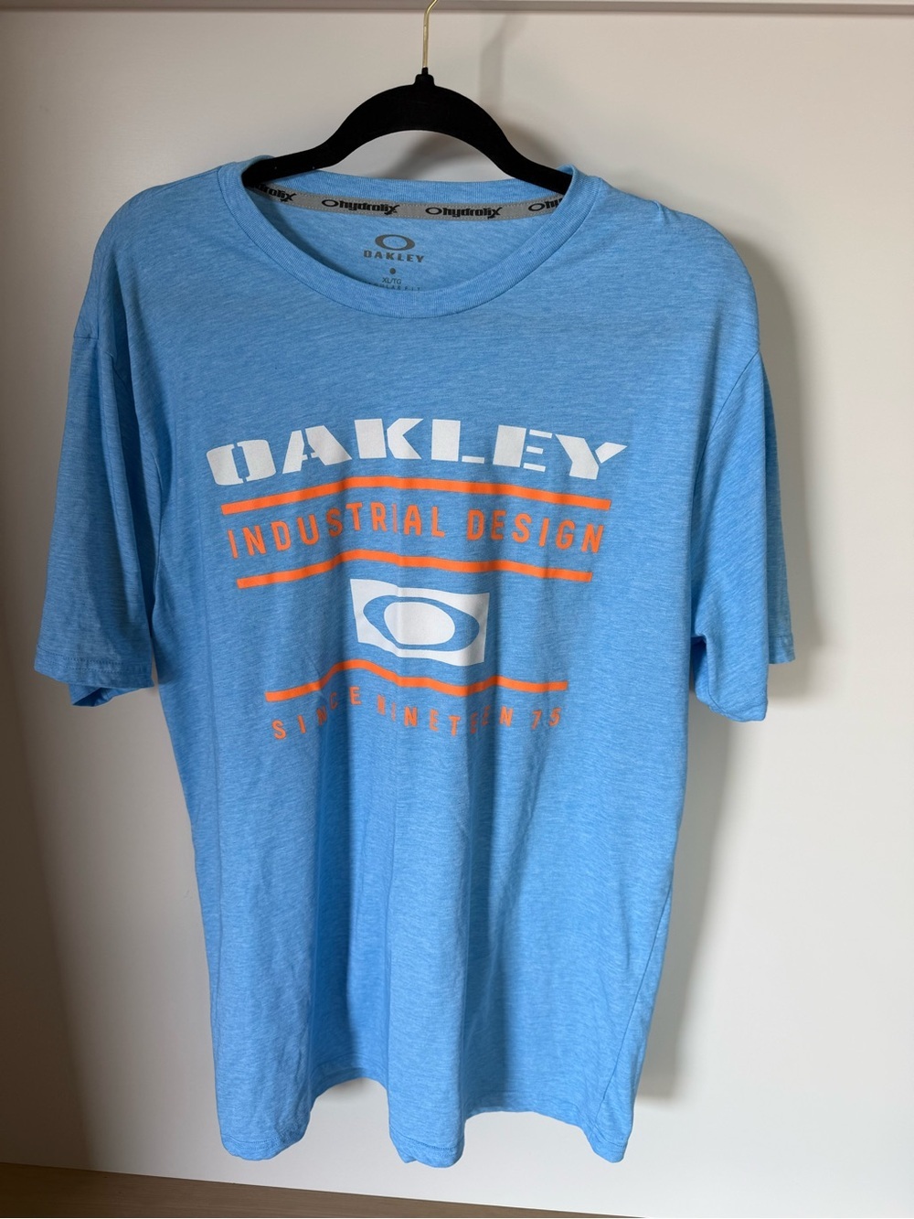 Oakley Light Blue Short Sleeve Tee with Orange & White Logo
